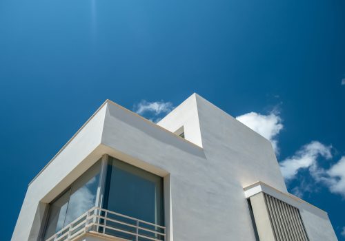 Modern Luxury Villa Against A Bright Blue Sky With Copy Space